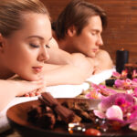 Attractive couple relax at the spa salon.